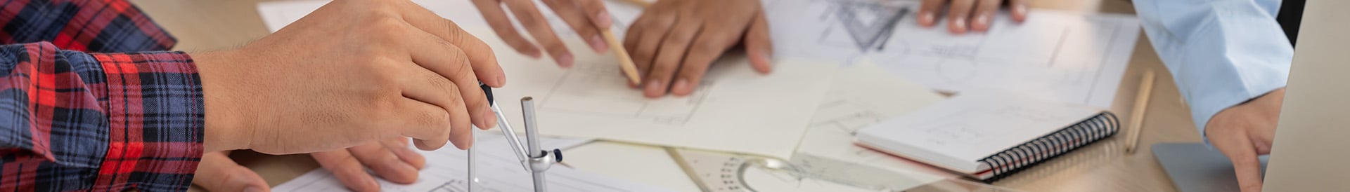 people drawing building plans